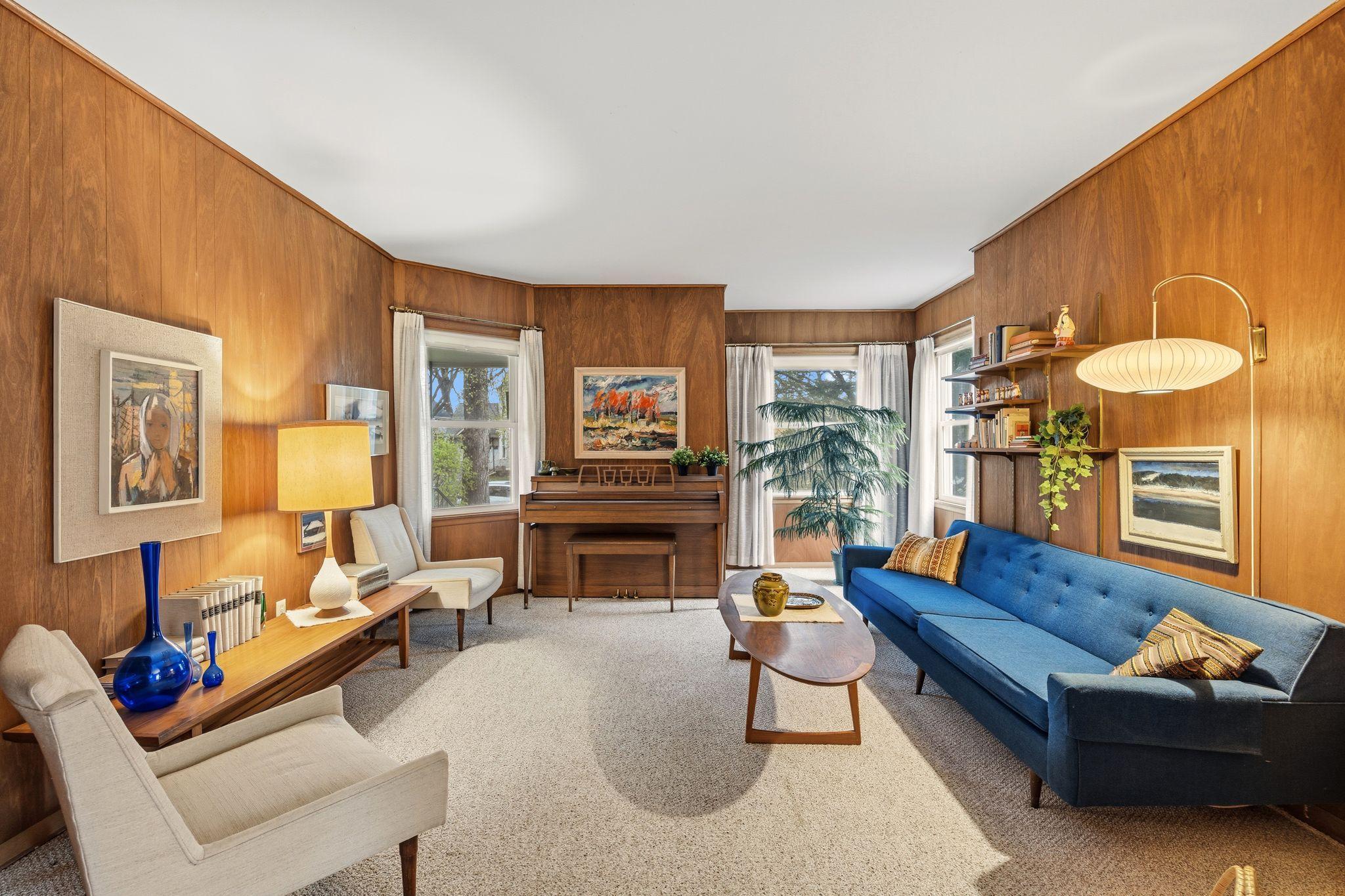 The light-filled living room seamlessly blends 1884 character with a clean, mid-century modern aesthetic. It’s an open, inviting space designed for both daily comfort and effortless entertaining.