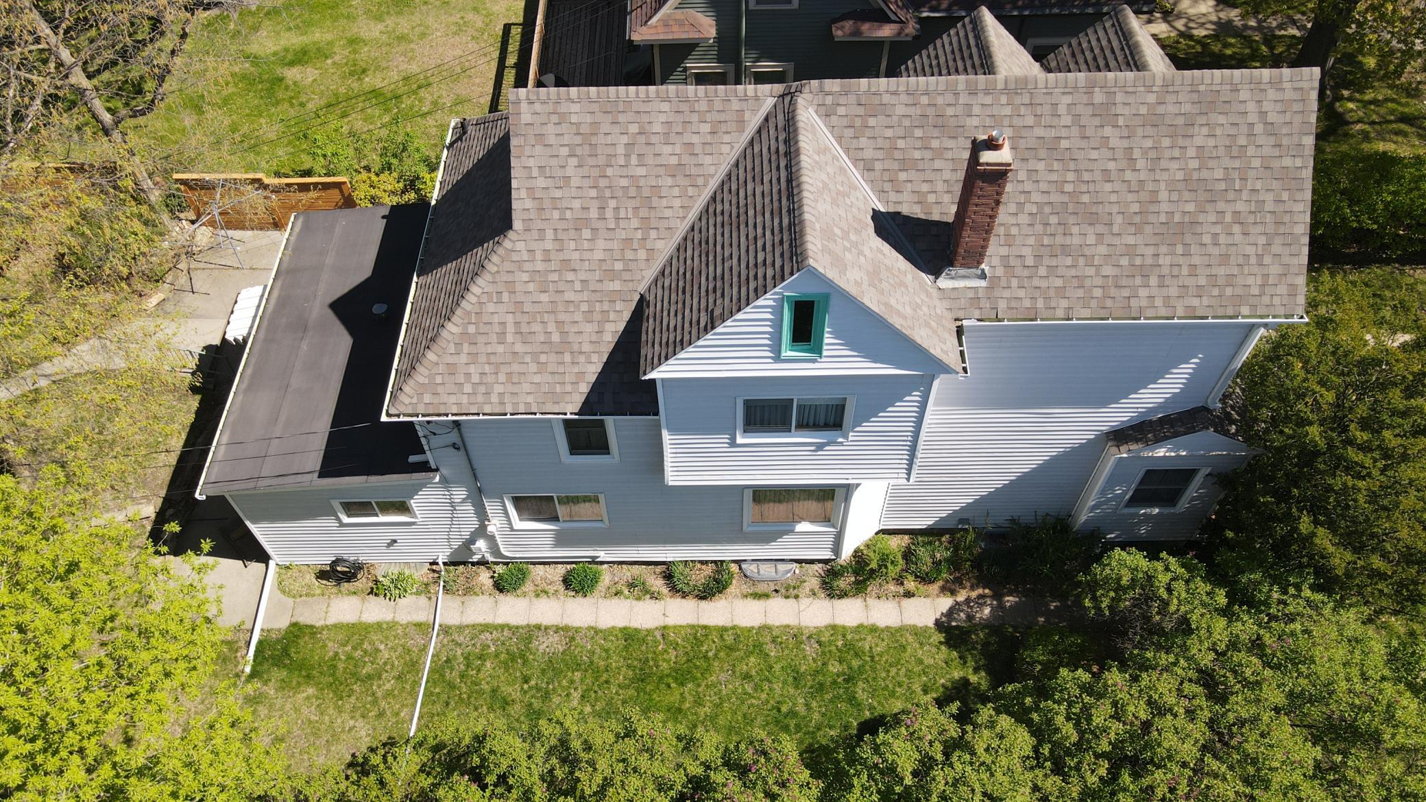 Drone photo - View of the top of the house and side yard
