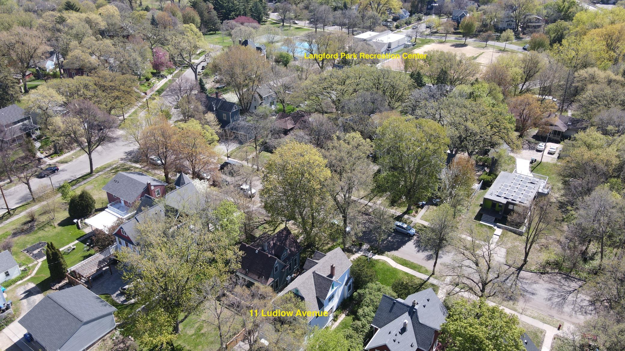 Drone photo with view of the 11 Ludlow house & Langford Park Recreation Center. There are activities that happen here for all ages.