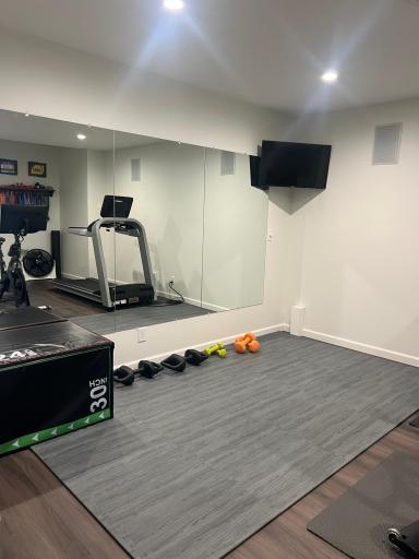 Cancel the gym membership! This home has a designated fitness room.