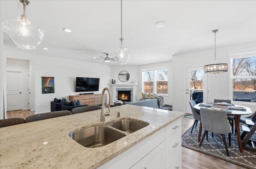 A gas fireplace creates the ambiance in the living area. This is one of two fireplaces in this home.
