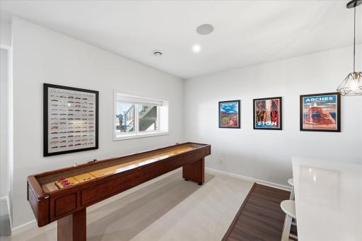 Game room space or set up a pub table for additional bar seating