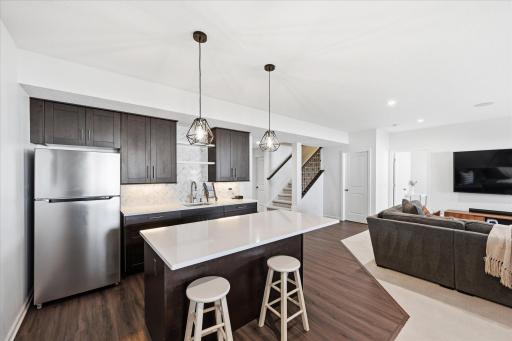 Wetbar or convert to mini kitchen for the extended family needs.