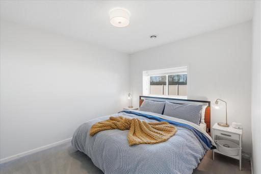 Lower level hosts a 5th conforming bedroom for guests.