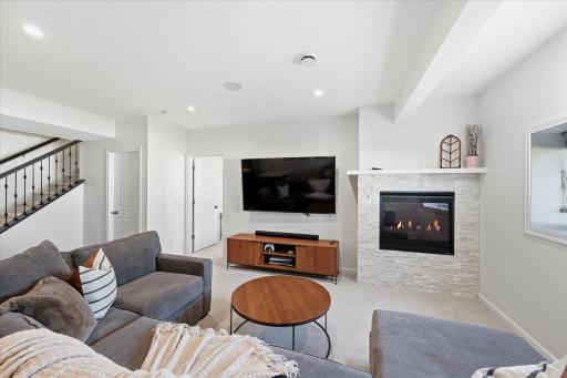 A second gas fireplace adds warmth and charm to the family room, creating yet another cozy spot to snuggle up, unwind, and relax.