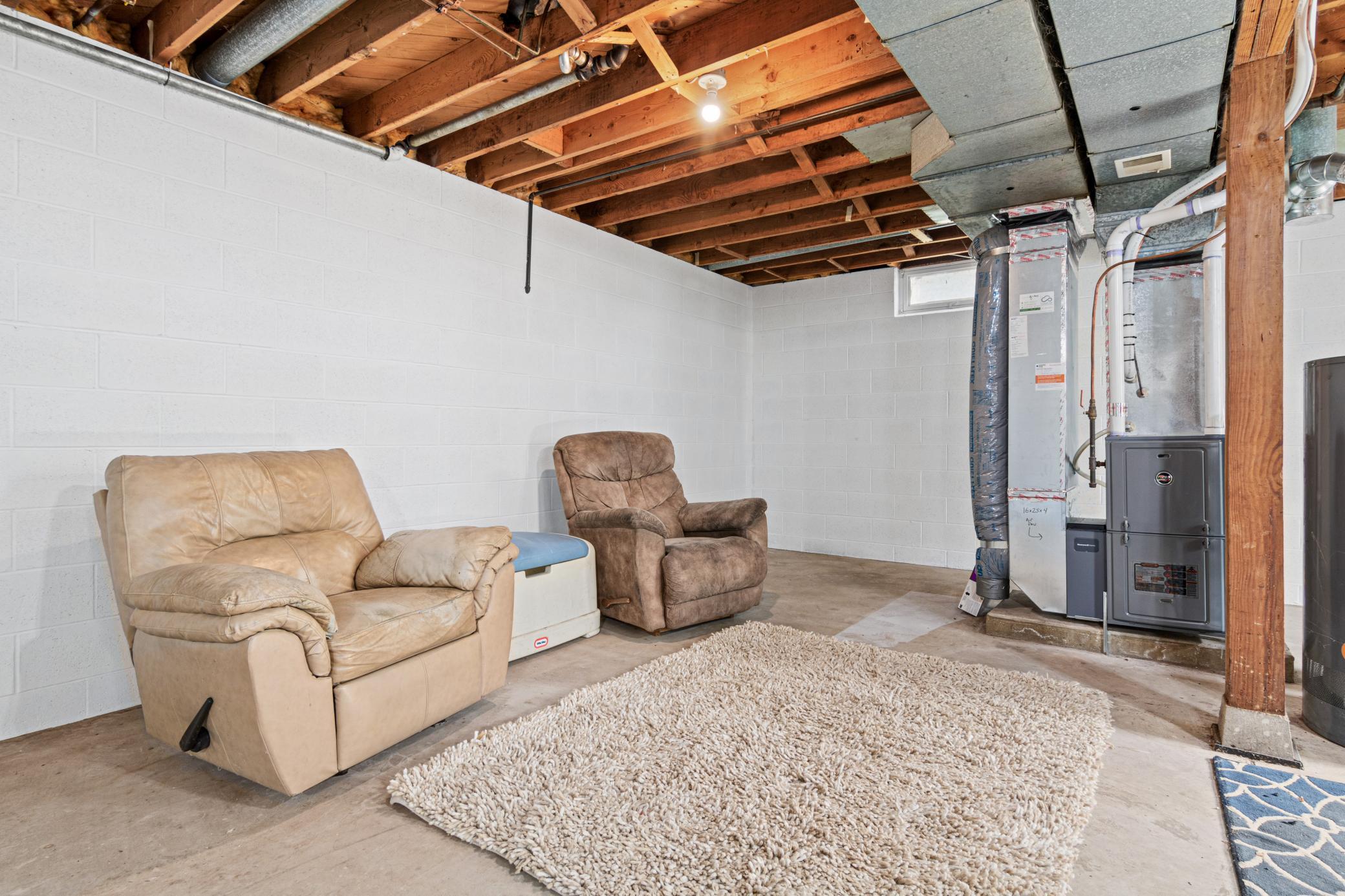 Unfinished basement area - All basement walls freshly painted