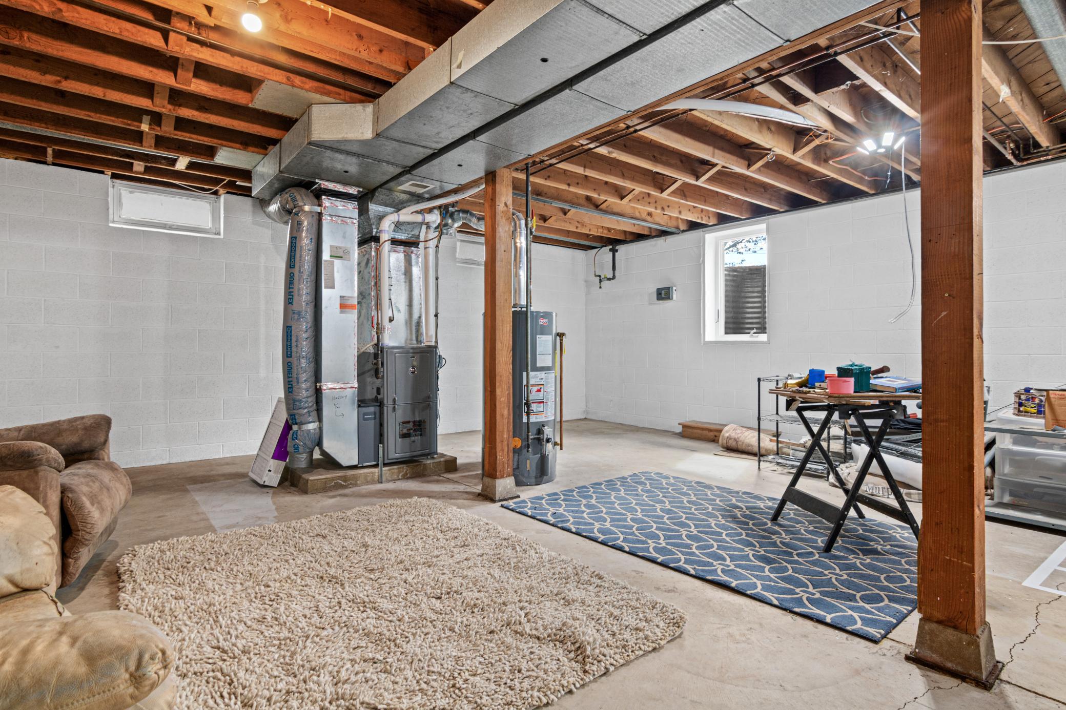 Unfinished basement area with an egress ready for a potential future bedroom