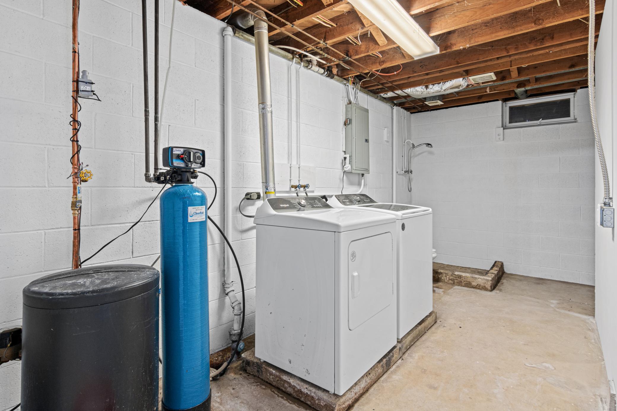 Laundry / partial bath (toilet and shower stall)
