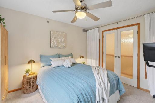 A unique and comfortable space with French doors and windows to the hall to share the sunlight, with new floor to ceiling curtains for privacy and a bit of style!