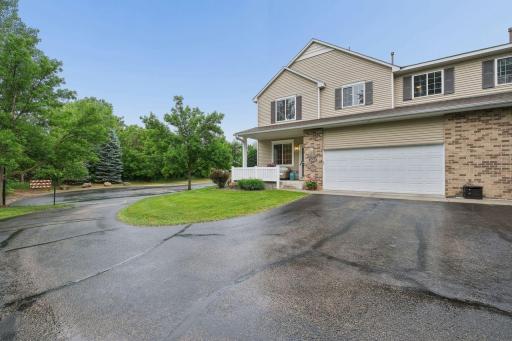 This property features 2 car garage at extra guest parking at the end of the building.