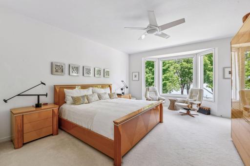 Main-level primary suite with lake views and an ensuite bath.