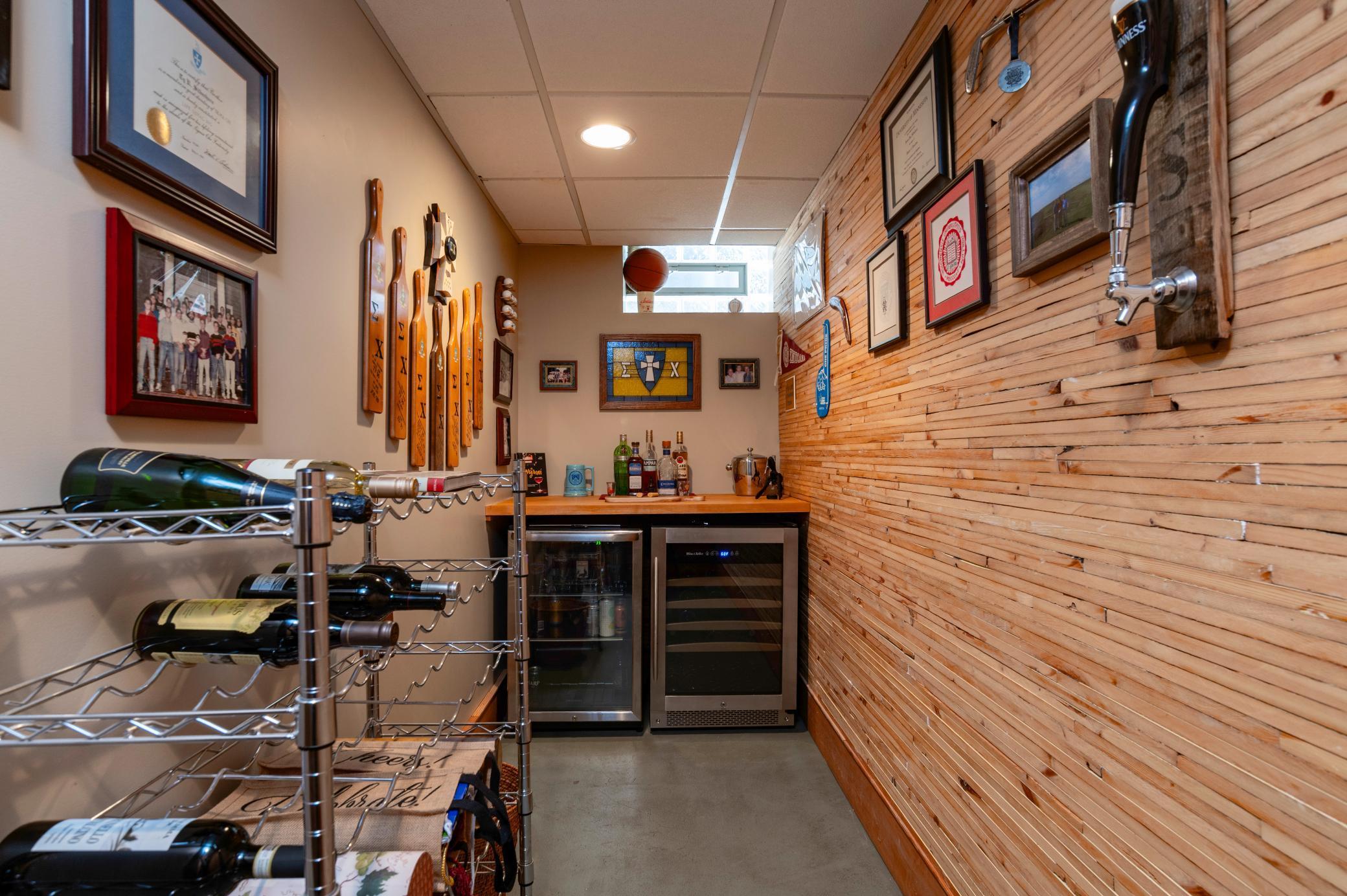 Refinished lathe from the home was installed on the walls to add character and charm to the bar room.