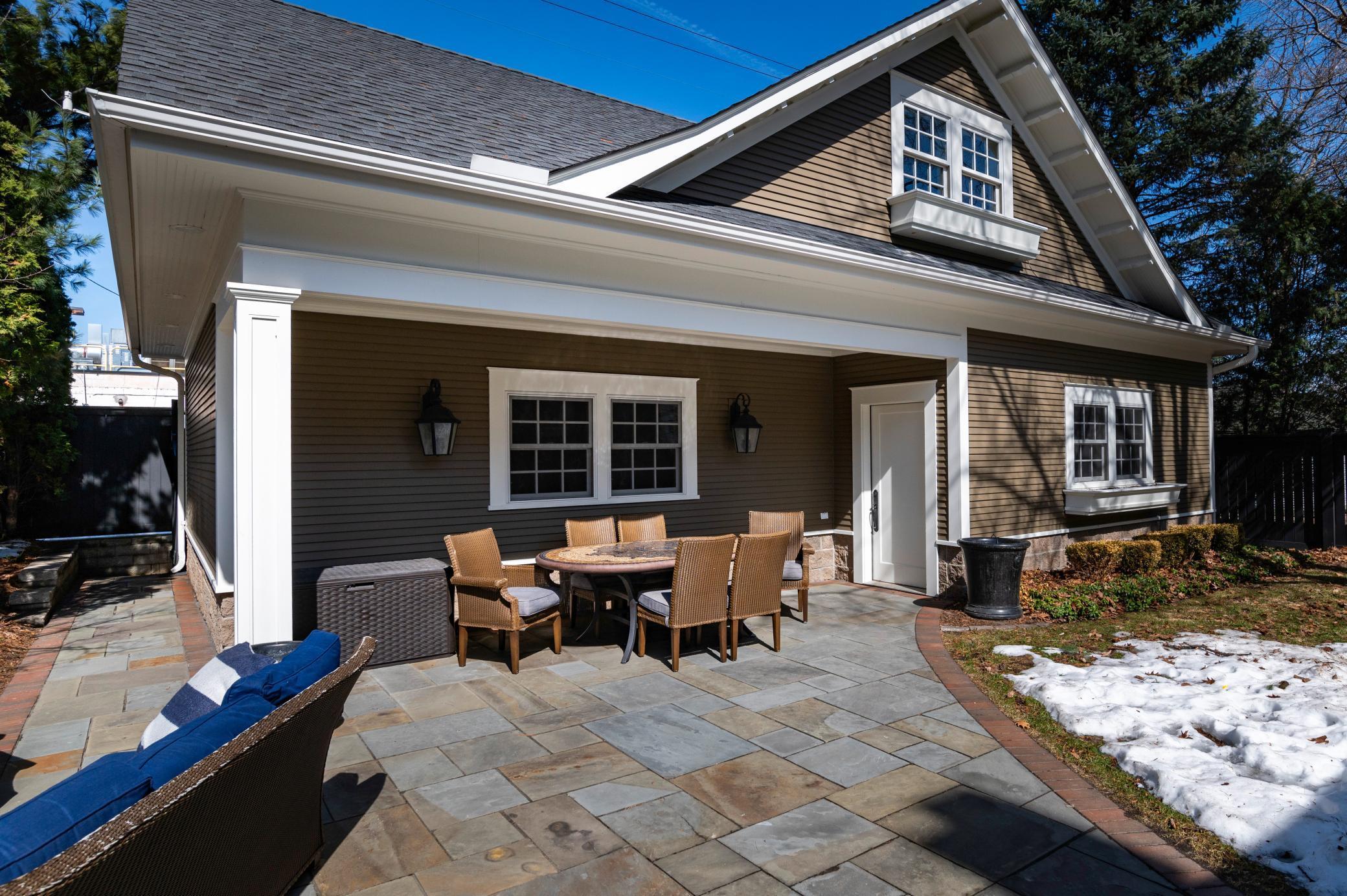 Ideal for entertaining the flagstone patio has both casual seating and dining areas.