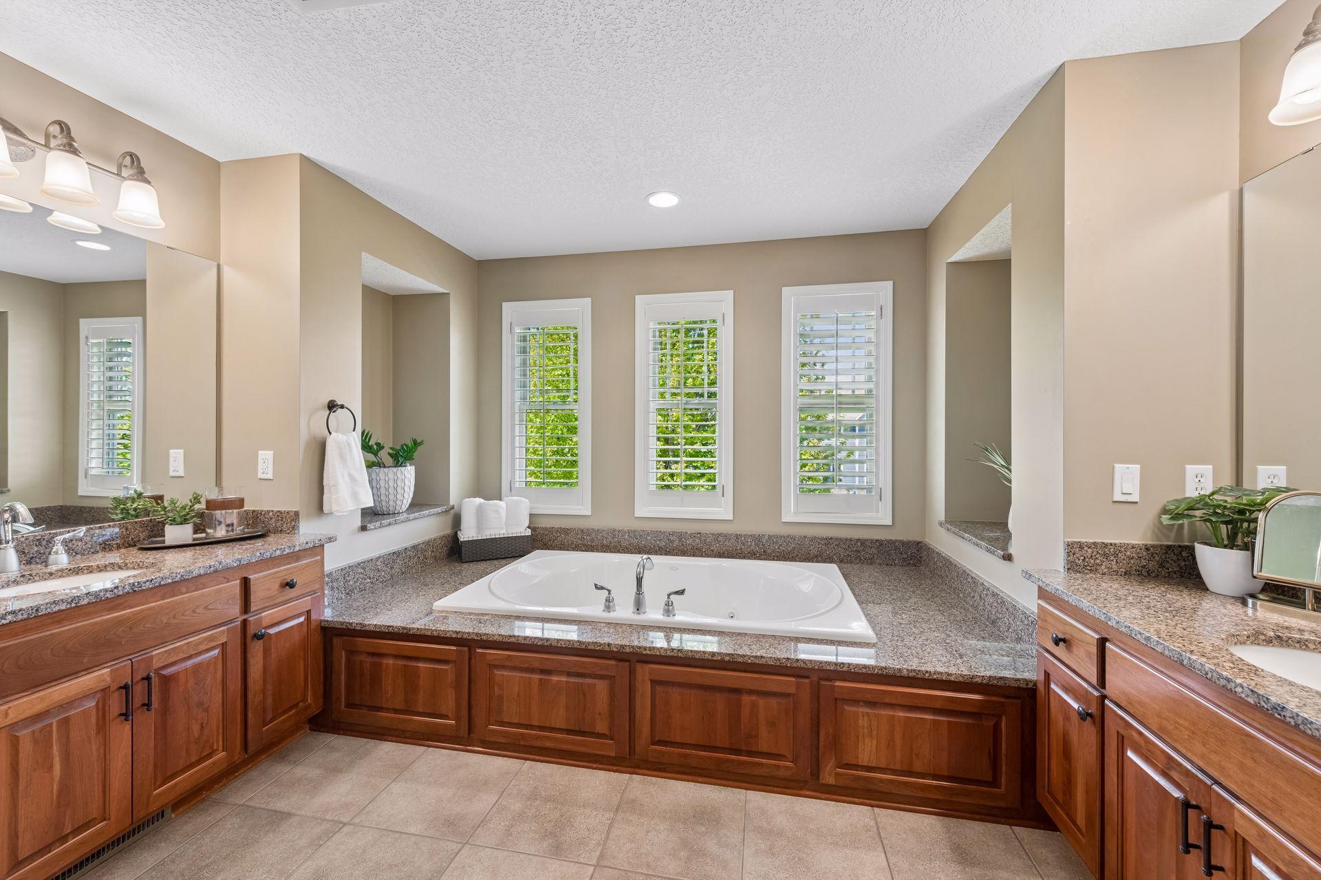 Soaking tub with seperate vanities