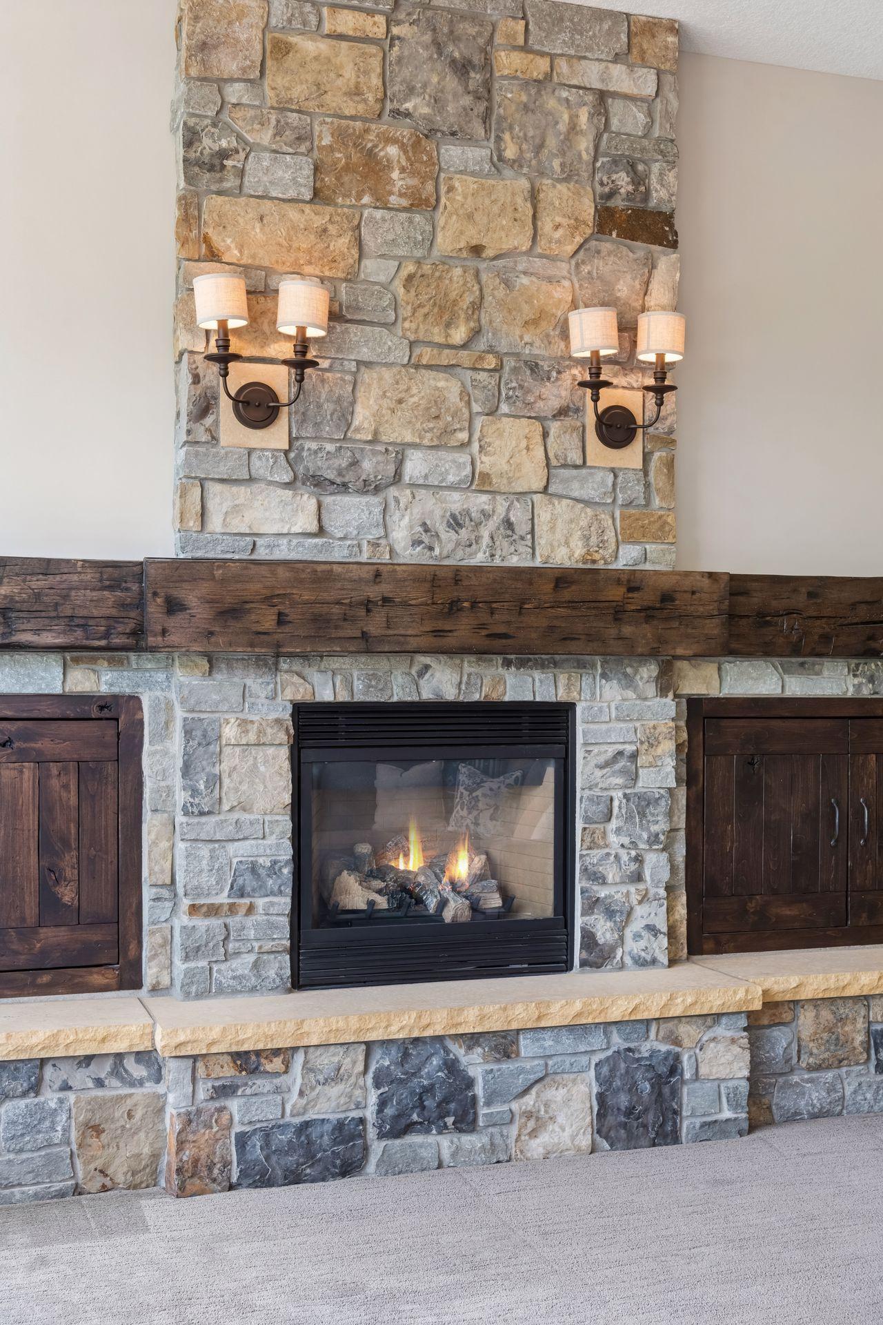 Fireplace with stone going all the way to the ceiling