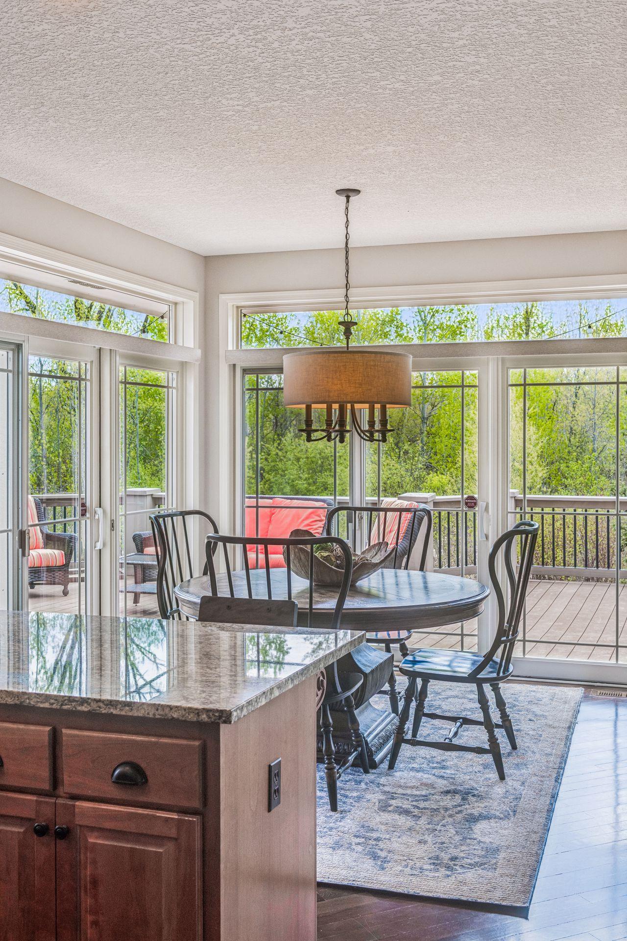 Sliding glass doors opening out to to expansive deck