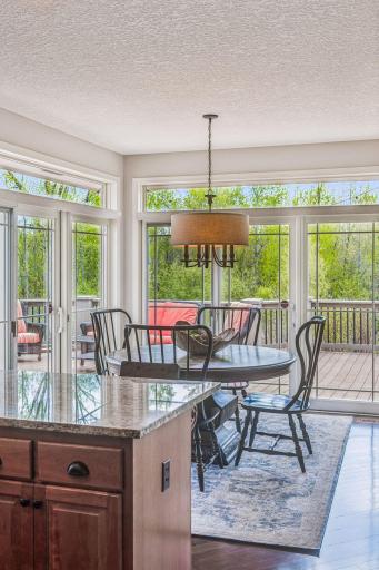 Sliding glass doors opening out to to expansive deck