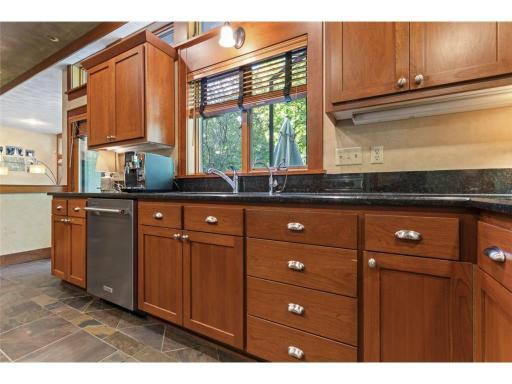 Under Cabinet Lighting and Window Over the Sink Looking Out onto Scenic BackYard