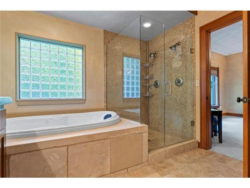Primary Bath Has a Jetted Tub and a Separate Walk in Shower