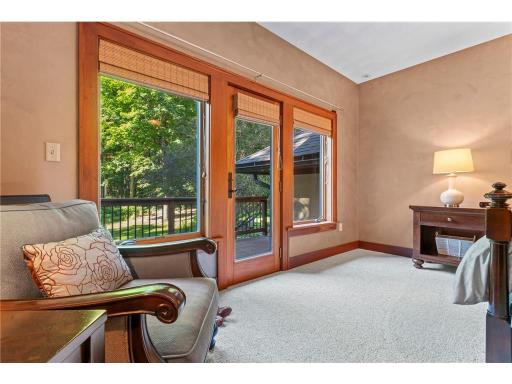 Primary Bedroom Walks out to Balcony Overlooking The Back Yard