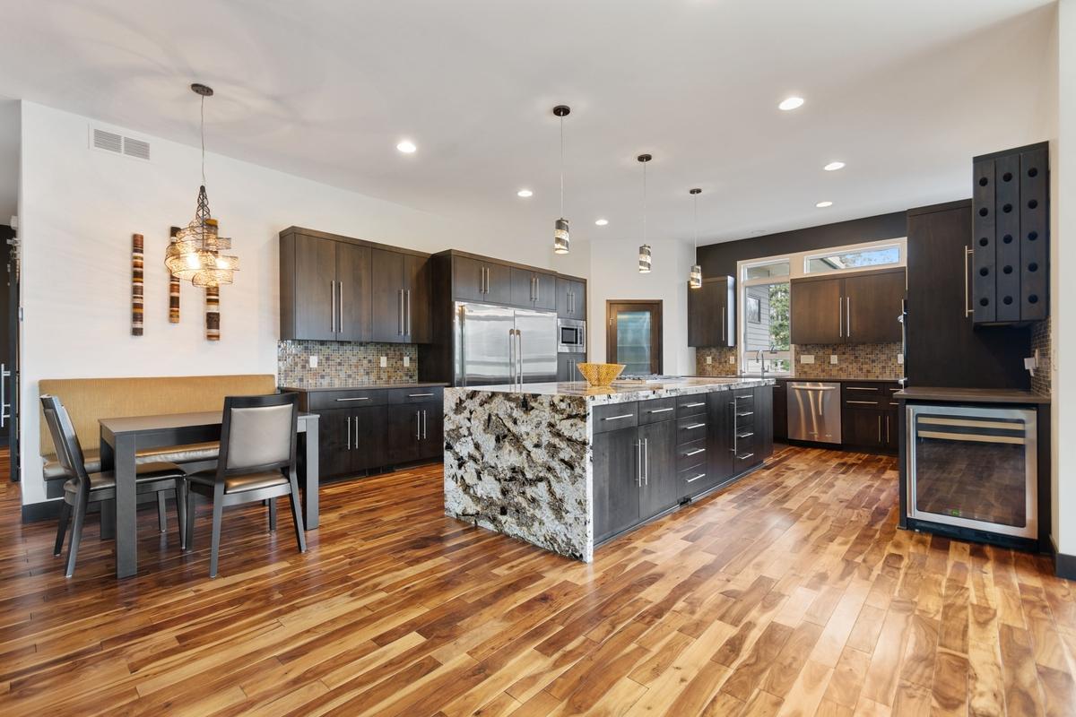 Gorgeous Kitchen island with wine fridge and wine racks, eat in kitchen area
