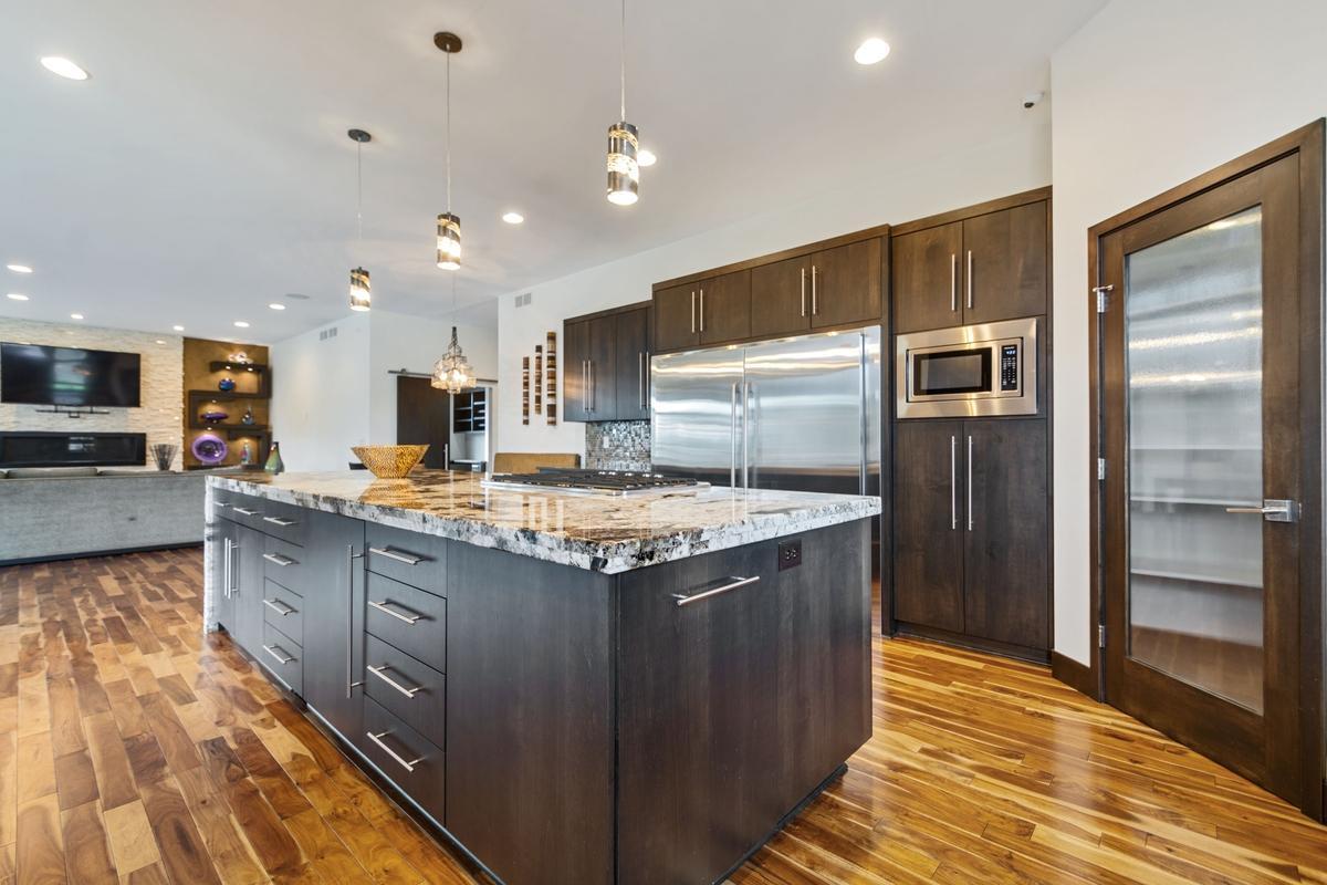 Every detail of this kitchen has been thoughtfully crafted. Check out the incredible fridge/freezer combo! Large pantry!