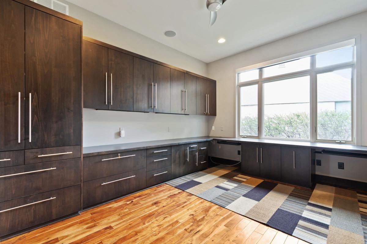 Office with incredible built ins - including wrapping station and printer/shredder pull outs