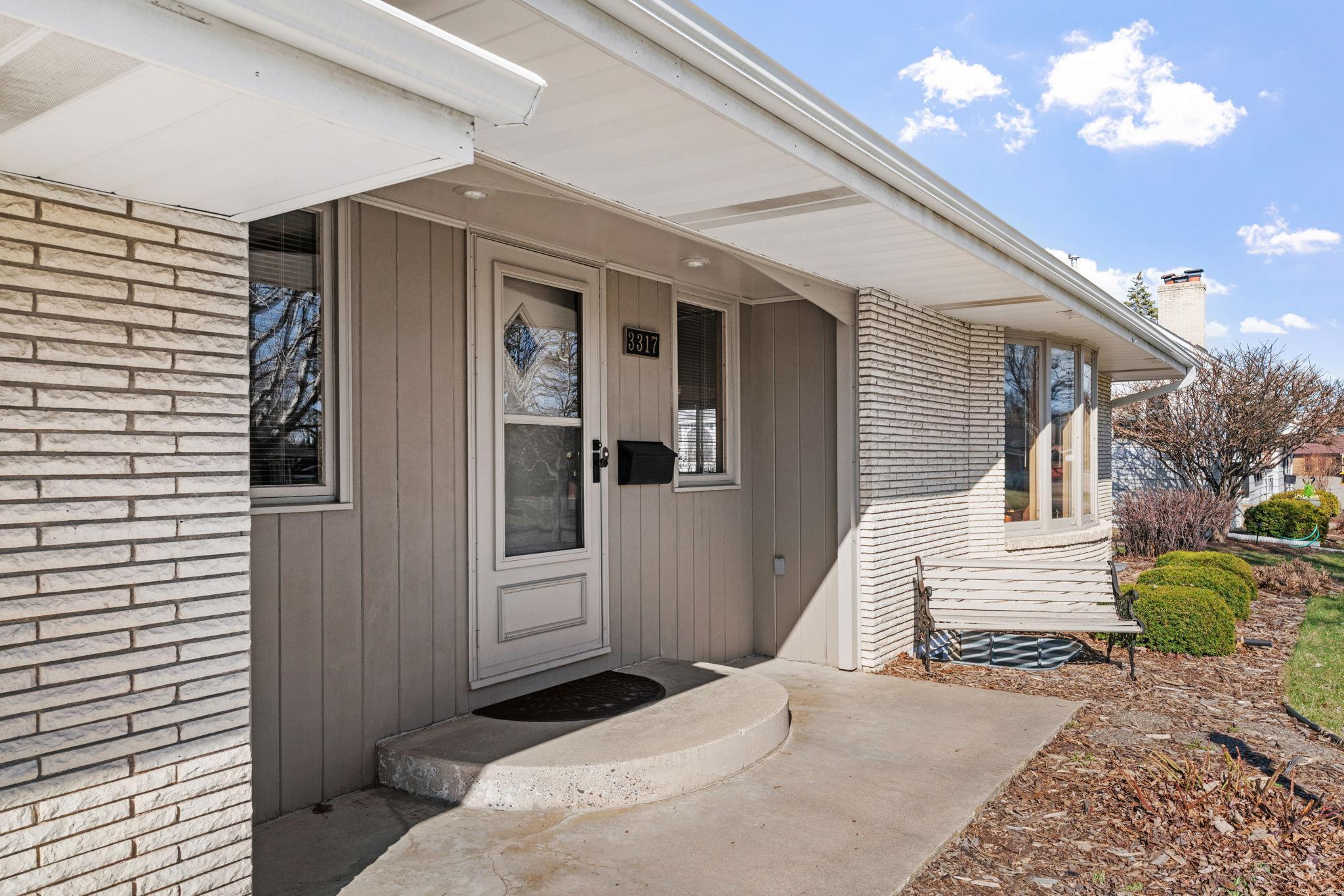 Nice front stoop welcomes you to the home.