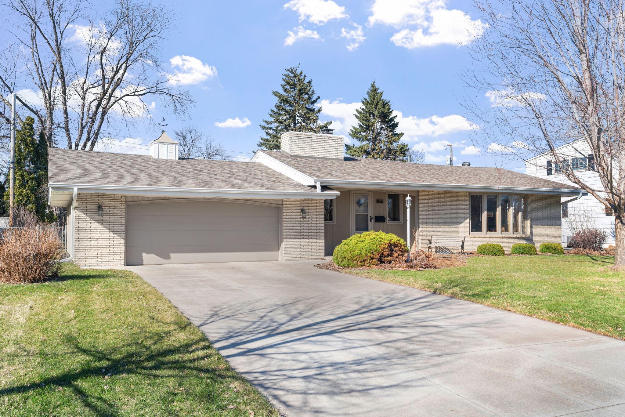 Wonderful St. Anthony rambler with two car attached garage