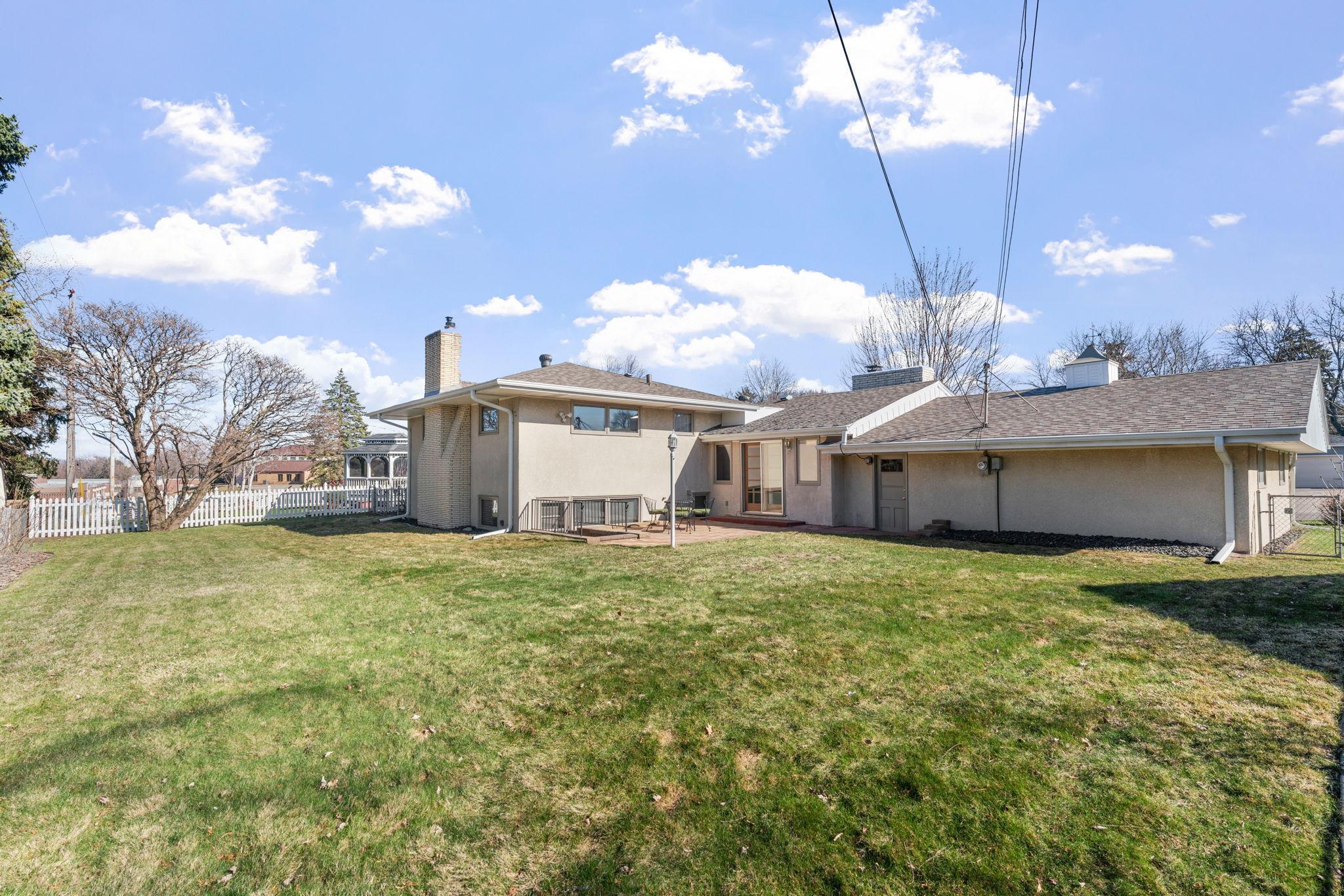 The yard is spacious and offers a great amount of green space