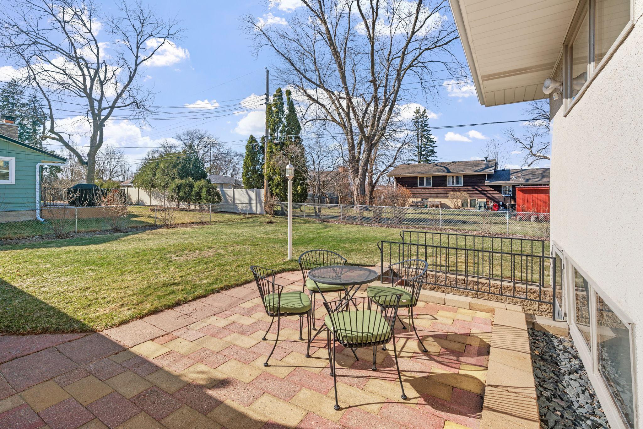 Doors from informal dining lead out to a large, sunny patio