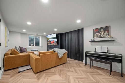 Entire lower level was recently finished/completed- Gorgeous custom wood accent wall~