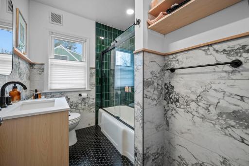 Updated full bathroom on the main level, with infloor heating.