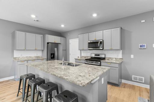 Wide open kitchen with center island, stainless and granite!