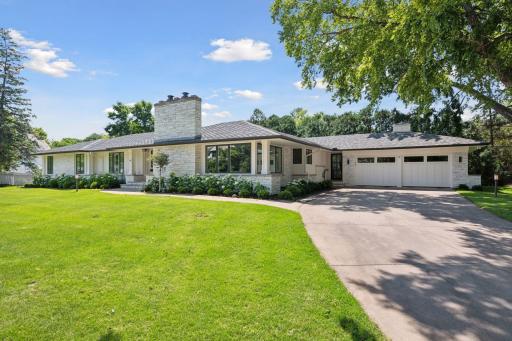 Introducing 14 Woodland Road, located in the sought-after Minnehaha Woods neighborhood of Edina, Minnesota.