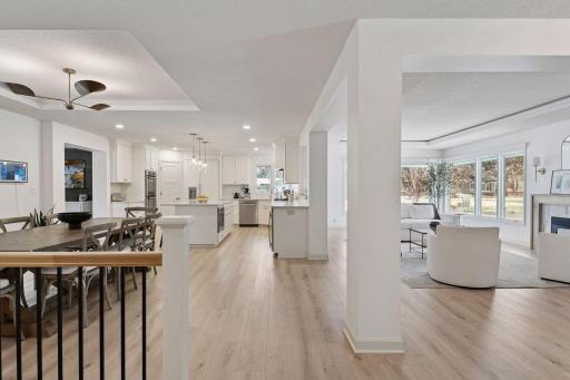 The main floor offers true one-level living with three bedrooms, three bathrooms, and a laundry room.