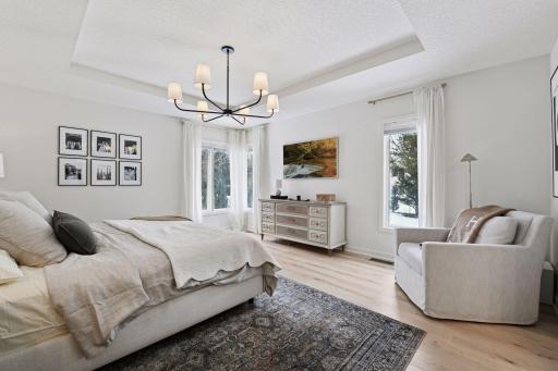 The spacious primary suite features a large private bathroom and generous walk-in closet.