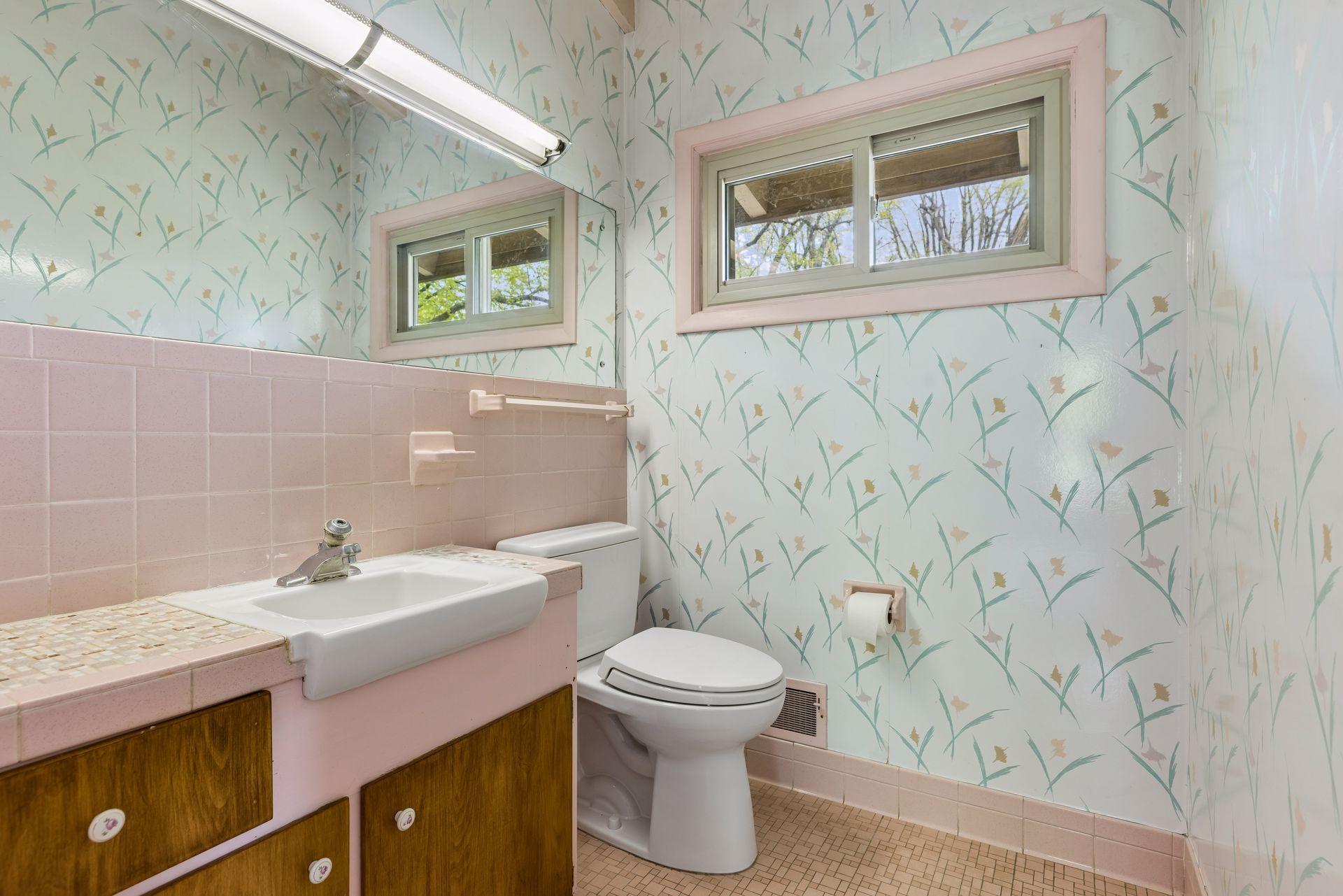 Primary, private 1/2 bath. Festive colors...or bring your renovation ideas.