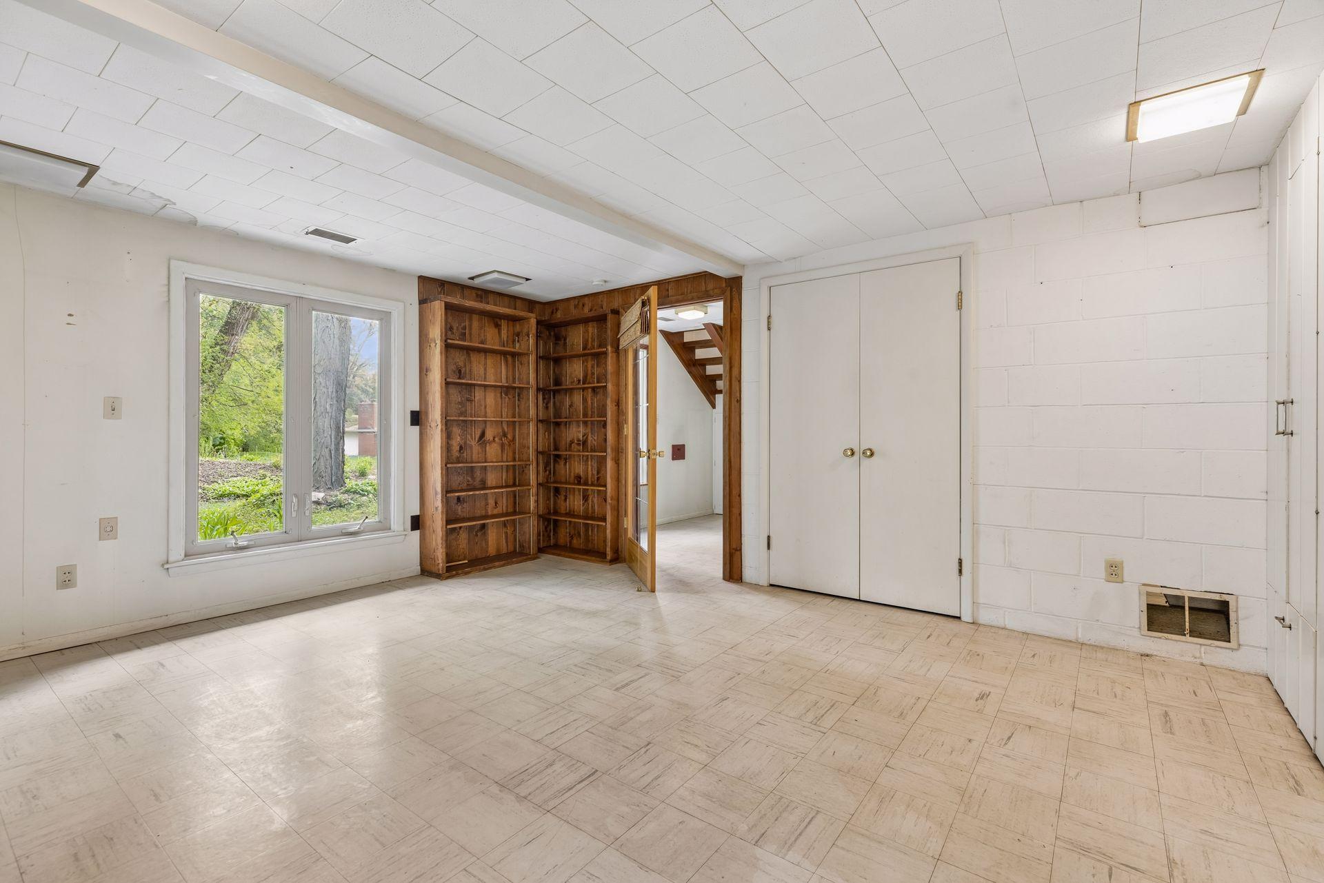 Bedroom with built-in cabinets. Full lookout/egress windows.