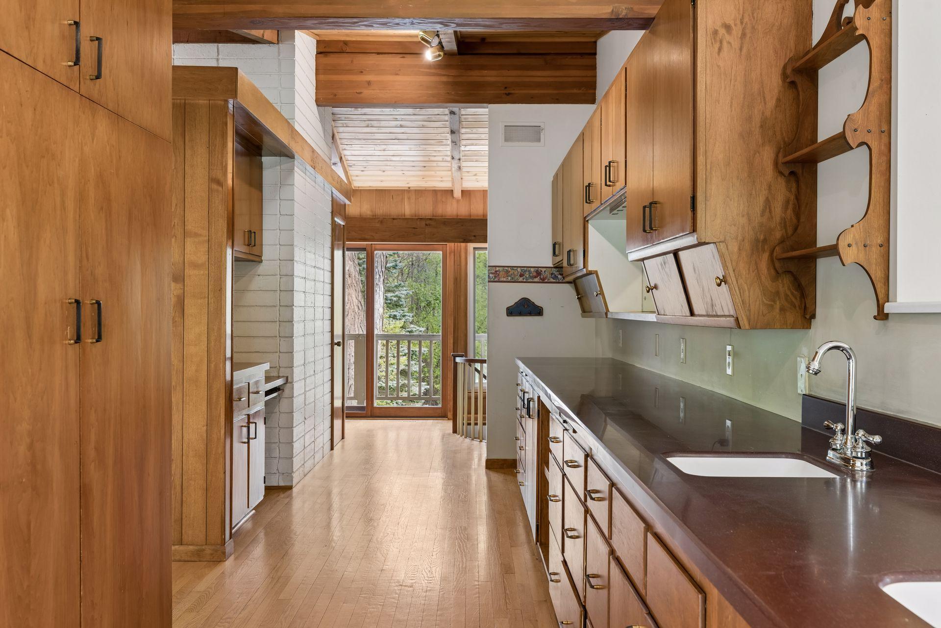 Kitchen pantry/storage and prep space. Wall between living room and "pantry" are not structural. Fireplace is structural.