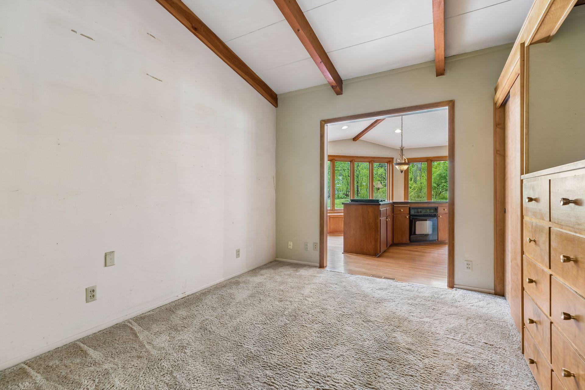 Office space just off kitchen. Continuous vaulted ceiling.