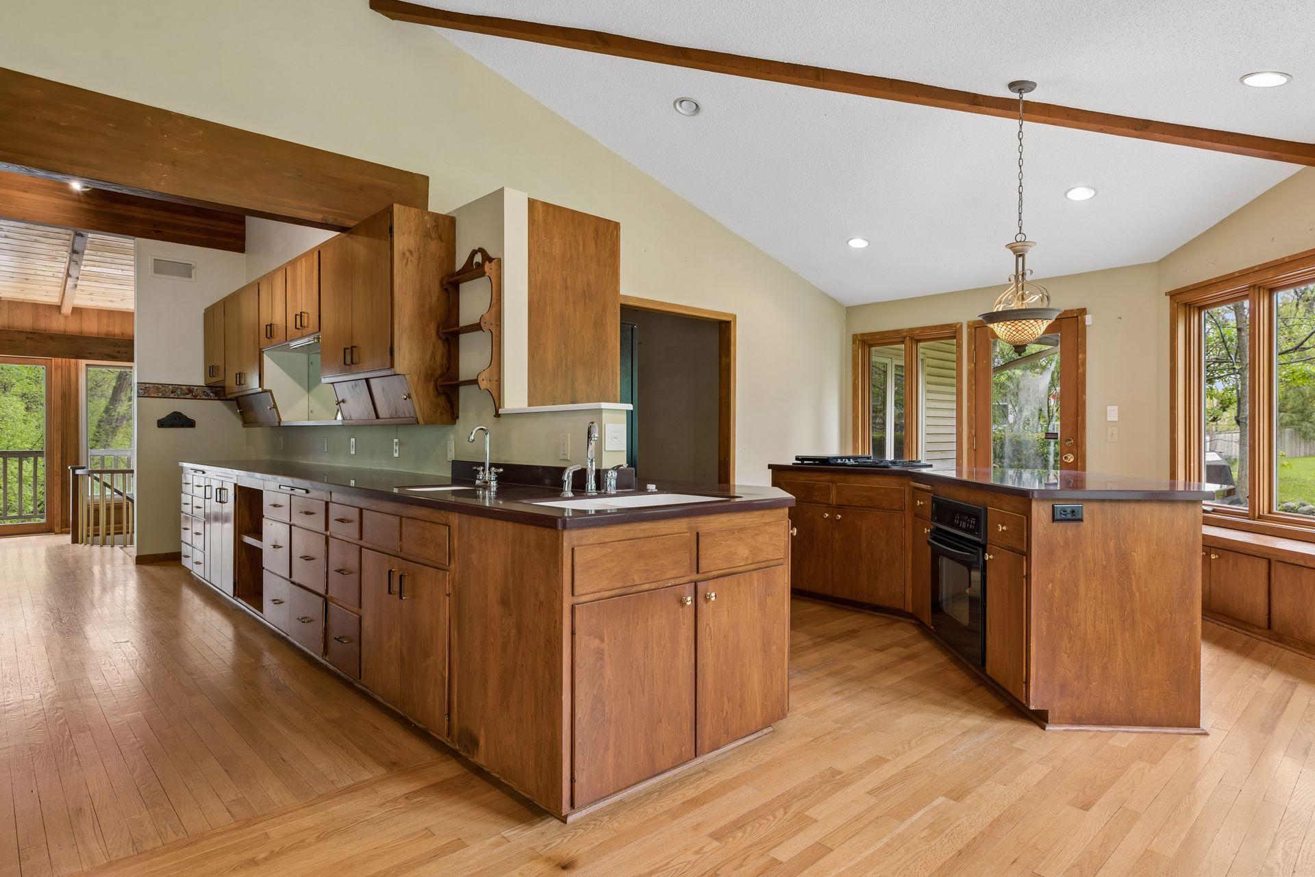 Kitchen immediately adjacent prep-space and storage (pantry). The prep space had been the kitchen prior to current owner's changing the floorplan. Bring your renovation imaginations.