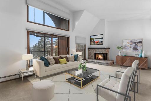 Another perspective of the cozy living room. (Digitally Staged)
