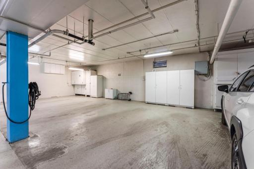 The unit includes an underground heated garage spot with extra storage cabinets.