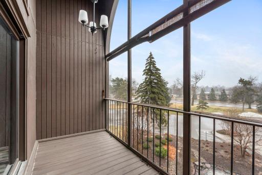 Accessible from the living room, this 13Ã5 screened-in deck features sun shades and a hanging light fixtureâperfect for relaxing or entertaining.