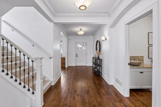 A grand foyer and sweeping hallway welcom you in and open effortlessly into the main living spaces -- a first impression that sets the tone for everything that follows.