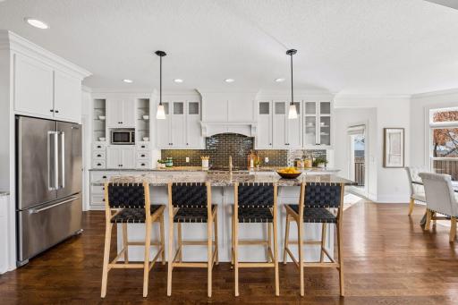 The oversized island anchors the heart of the home -- the perfect gathering spot for busy mornings, homework sessions and everything that makes a house a family home.