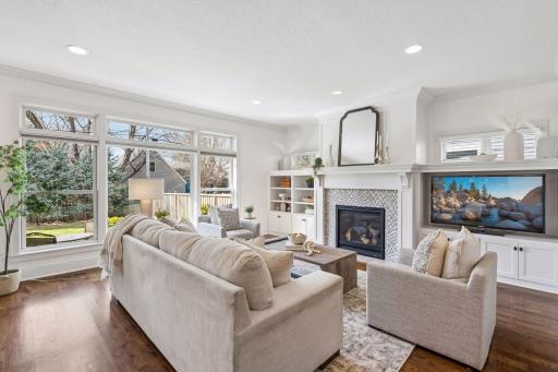 A living room centeerpiece that is both elegant and timeless with views of a gorgeous landscaped yard.