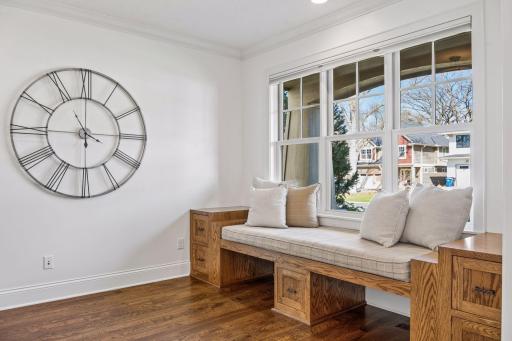 A sun-drenched front office with custom Roger Lind cabinetry offers the perfect work-from-home sanctuary --productive, polished and entirely inspiring