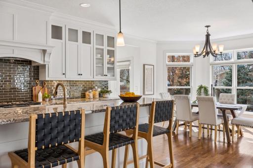 Every design decision in this kitchen, from the Roger Lind granite to the custom cabinetry and show-stopping lighting, reflects a commitment to beauty that never compromises on detail.